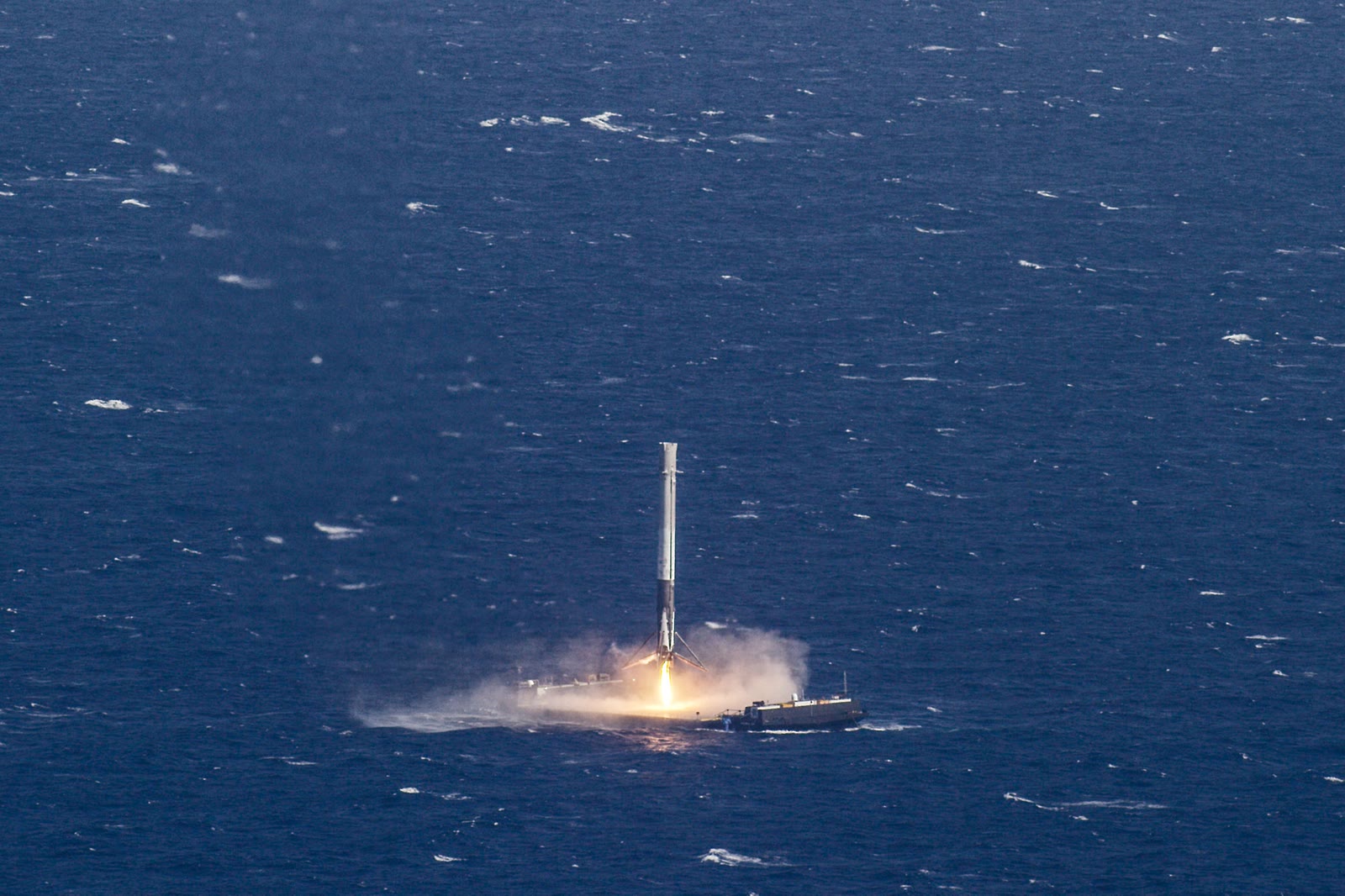 Falcon 9 first stage touching down on the autonomous droneship at sea
