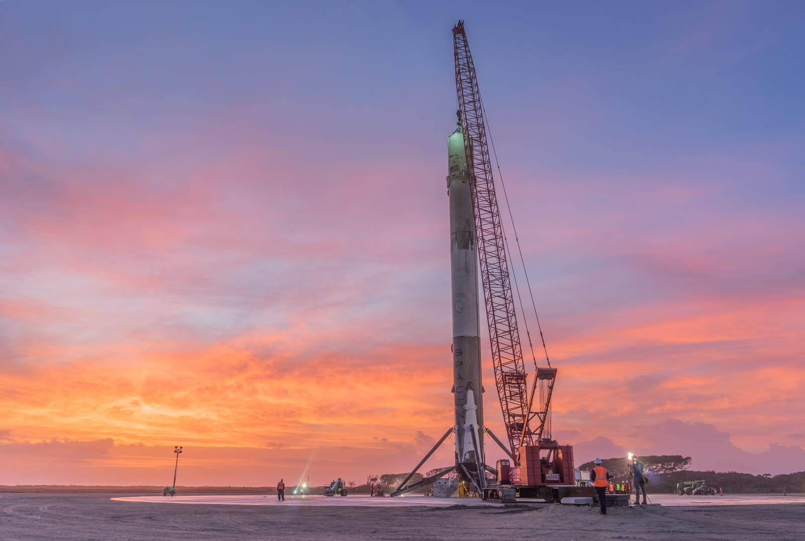 The first recovered Falcon 9 booster standing on Landing Zone 1 the morning after landing