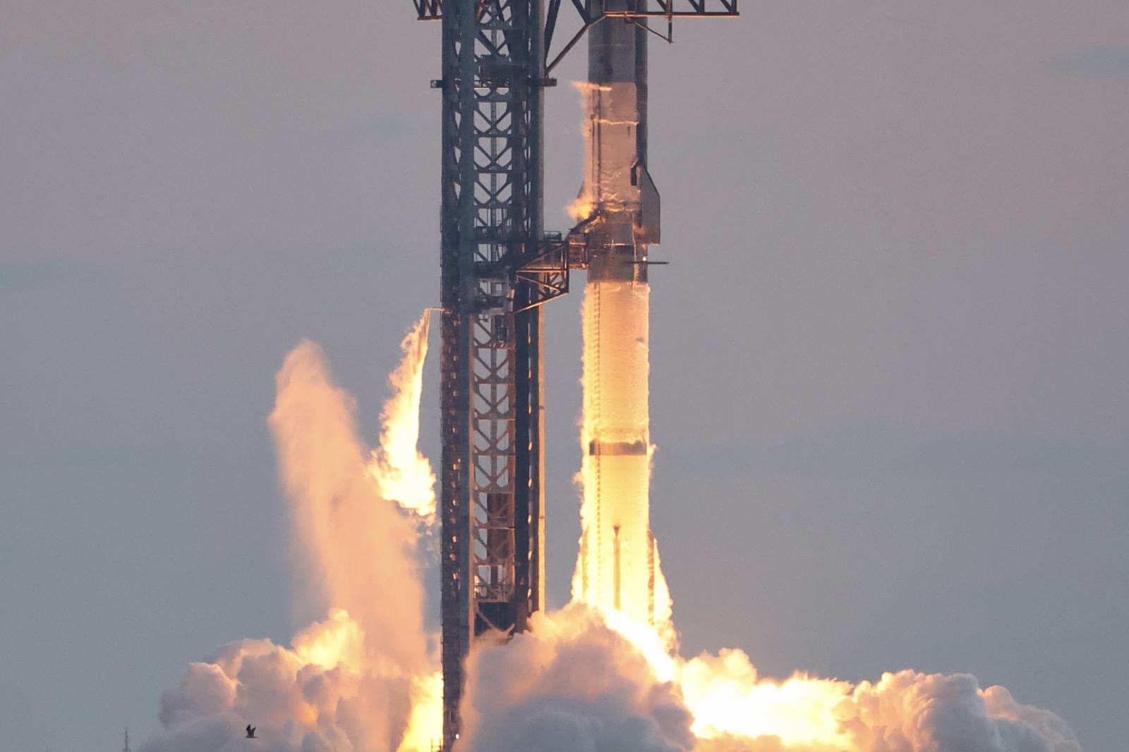 Thirty-three Raptor engines igniting under Super Heavy at the start of Flight 5