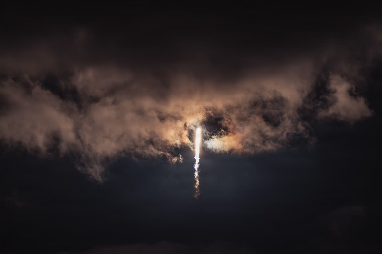 Falcon 9 lifting off at night on a Starlink mission from Cape Canaveral